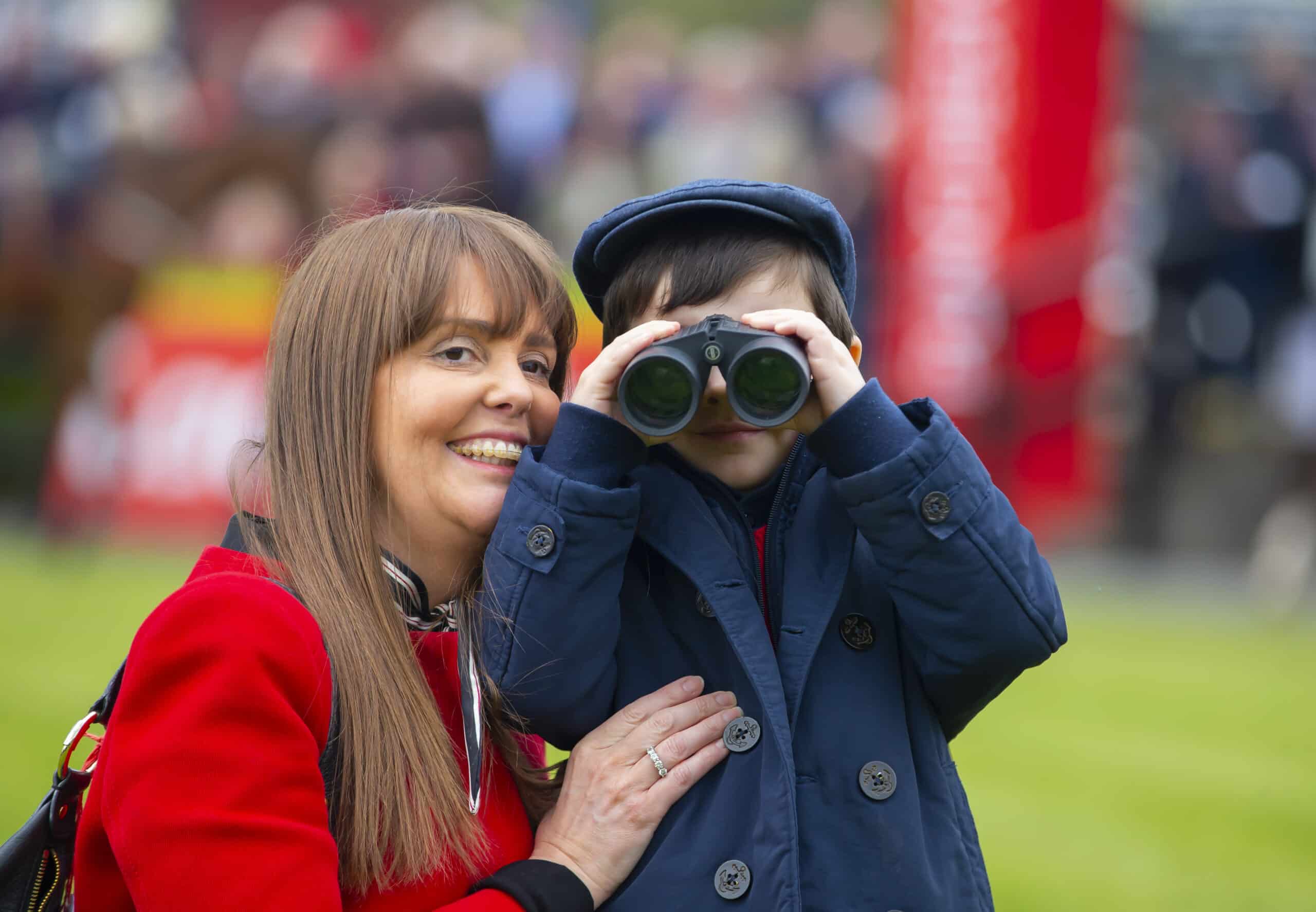 Mother and son with binoculars at The Big Family Day Out at Punchestown